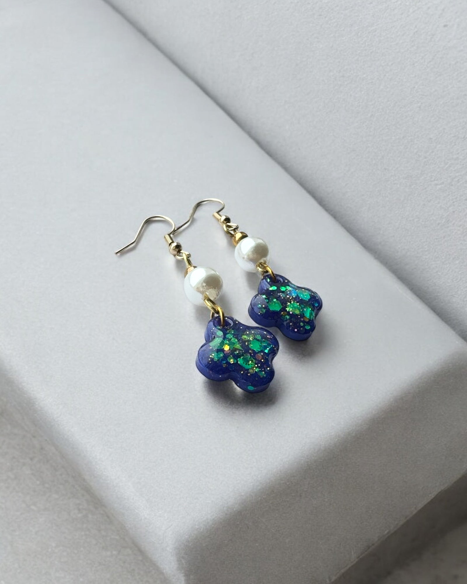 Frillmart Women's Dangle Earrings with Glittery Blue Floral Design, Pearl Beads, and Gold Accents