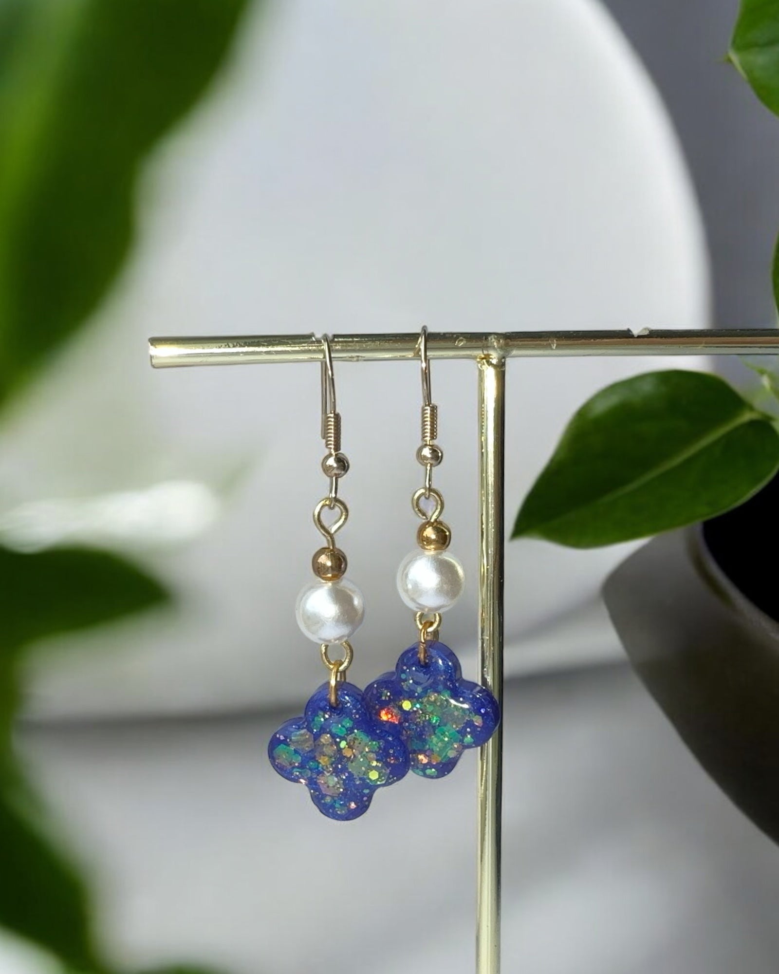 Frillmart Women's Dangle Earrings with Glittery Blue Floral Design, Pearl Beads, and Gold Accents